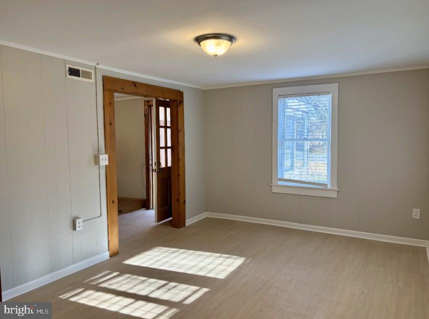 702 Federal Street Milton, DE 19968 - Photo 9 of 23 a view of an empty room with window and a bedroom