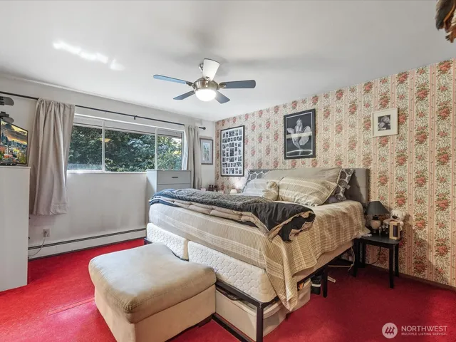 a bedroom with bed and a window