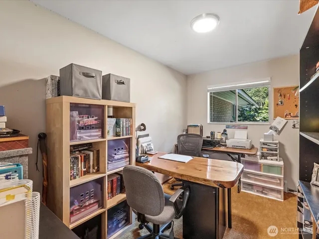 a view of a workspace with furniture