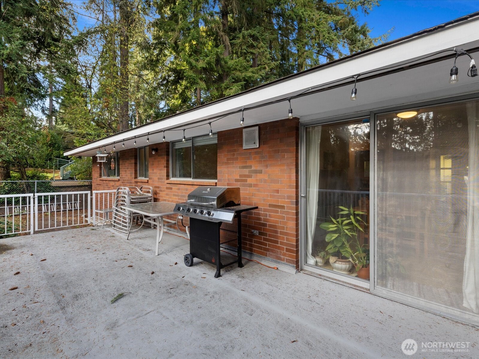 114 231st Street Southeast Bothell, WA 98021 - Photo 28 of 40 a backyard of a house with table and chairs