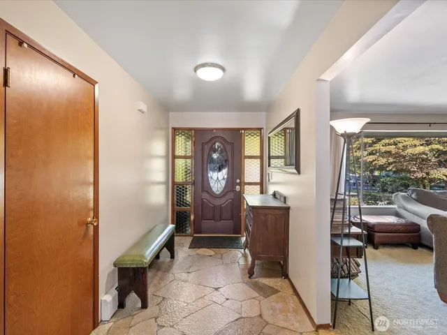 a view of a livingroom with furniture and windows
