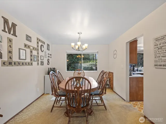 a view of a dining room with furniture window and outside view