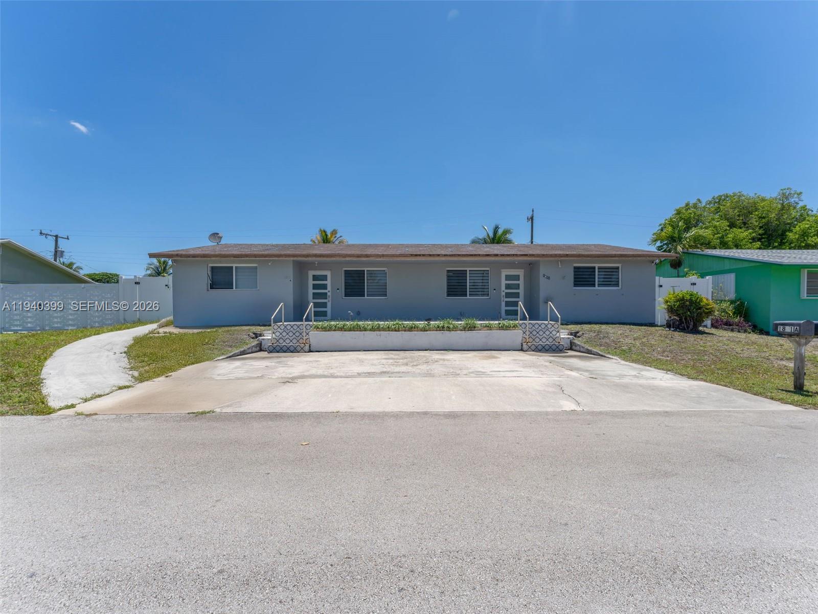 1811 Southwest 97th Terrace, Unit 2 Miramar, FL 33025 - Photo 1 of 29 a view of swimming pool in front of building
