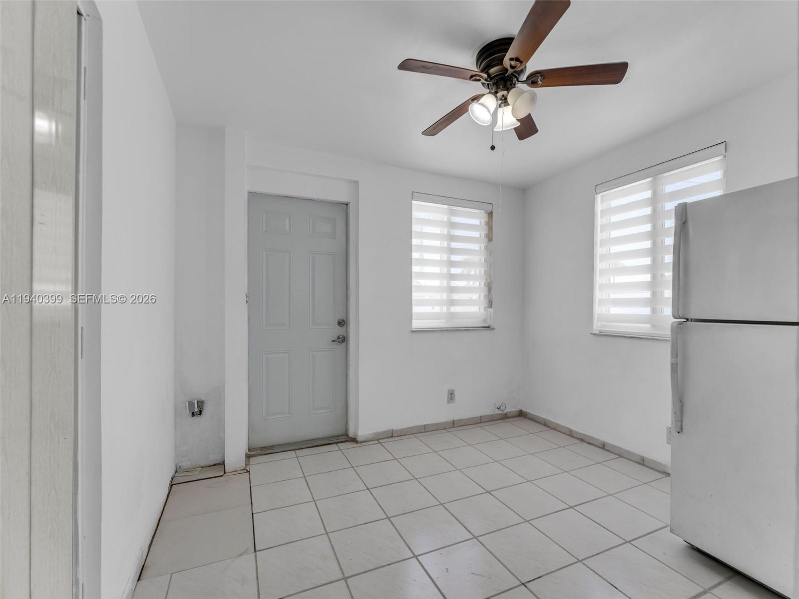 1811 Southwest 97th Terrace, Unit 2 Miramar, FL 33025 - Photo 15 of 29 a view of an empty room with a window