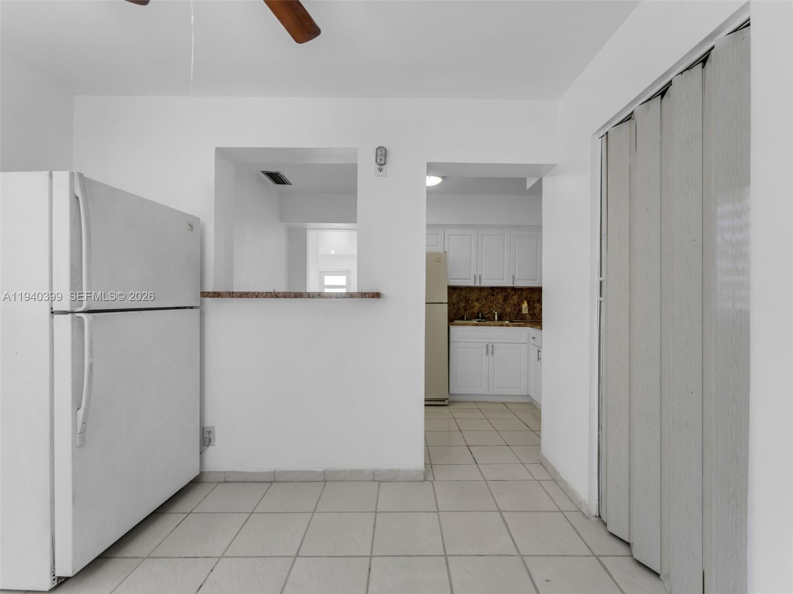 1811 Southwest 97th Terrace, Unit 2 Miramar, FL 33025 - Photo 16 of 29 a view of a refrigerator and window in a kitchen