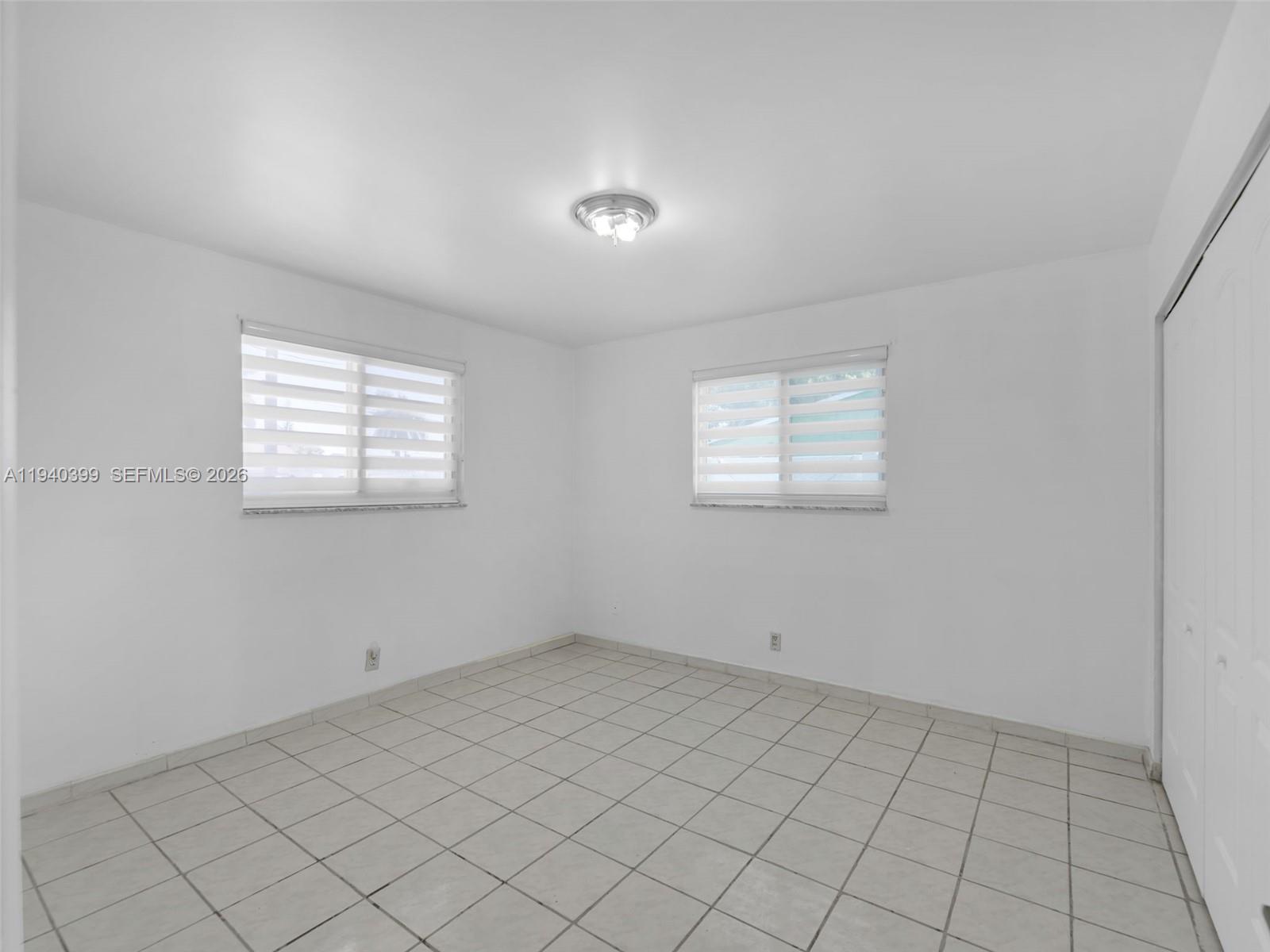 1811 Southwest 97th Terrace, Unit 2 Miramar, FL 33025 - Photo 24 of 29 a view of an empty room and window