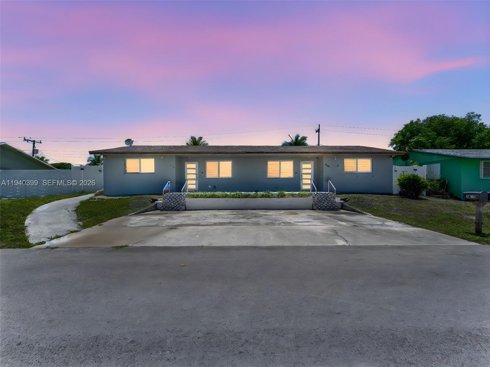 1811 Southwest 97th Terrace, Unit 2 Miramar, FL 33025 - Photo 29 of 29 a front view of a house with a yard and outdoor space