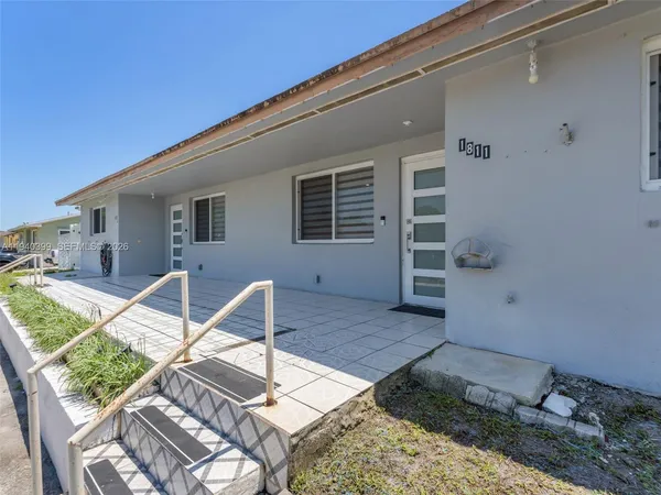 front view of a house with a bench