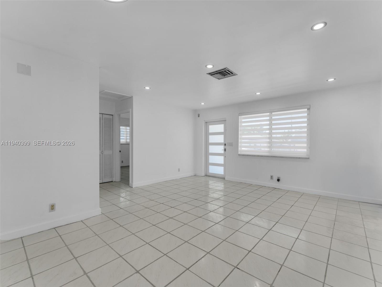 1811 Southwest 97th Terrace, Unit 2 Miramar, FL 33025 - Photo 6 of 29 a view of an empty room and window