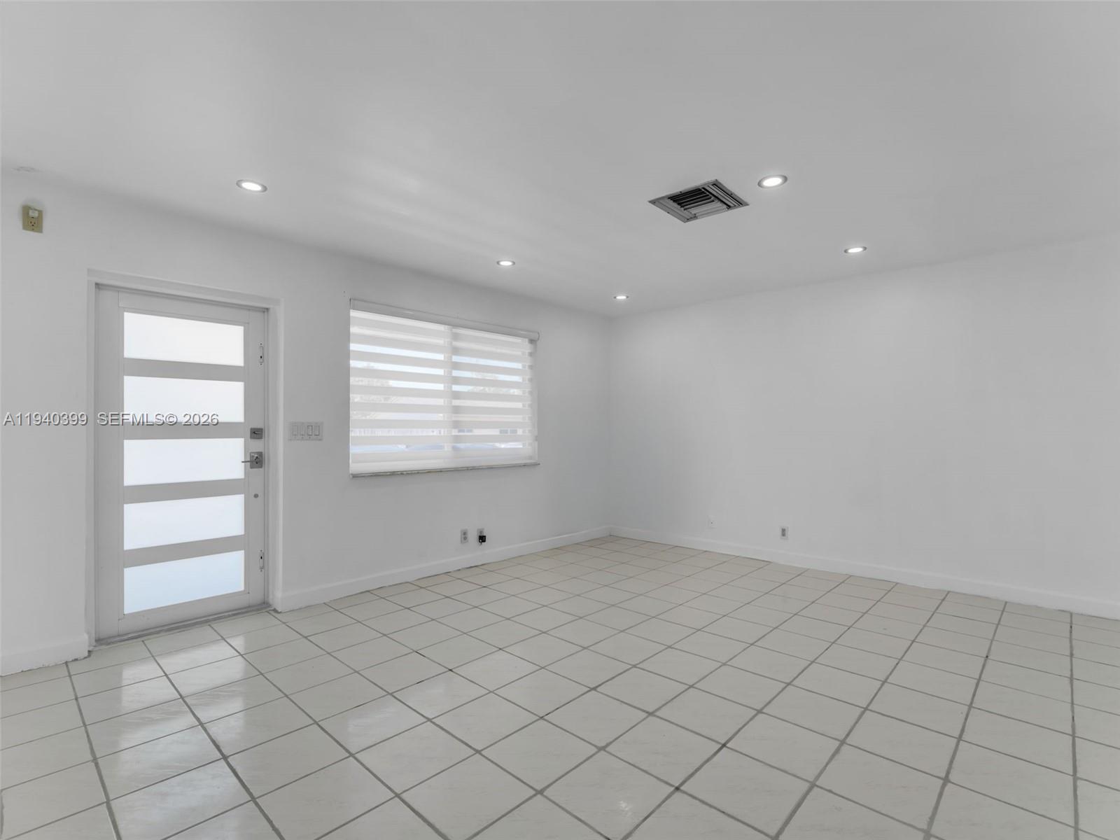 1811 Southwest 97th Terrace, Unit 2 Miramar, FL 33025 - Photo 8 of 29 an empty room with windows