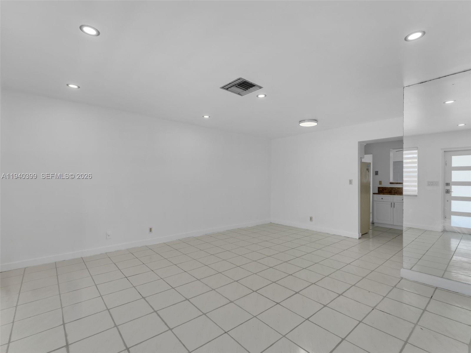 1811 Southwest 97th Terrace, Unit 2 Miramar, FL 33025 - Photo 9 of 29 an empty room with kitchen view