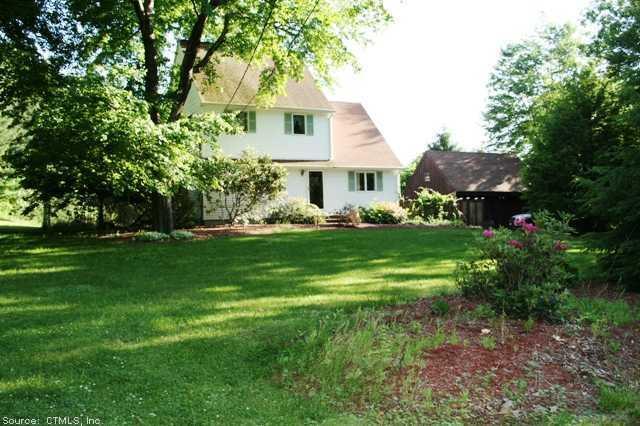 5 Jackson Road Plainfield, CT 06374 - Photo 1 of 1 a front view of a house with garden
