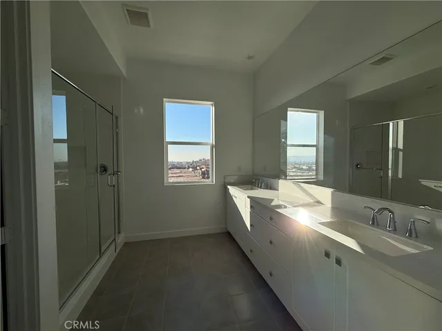 a bathroom with 2 sink tub and a mirror
