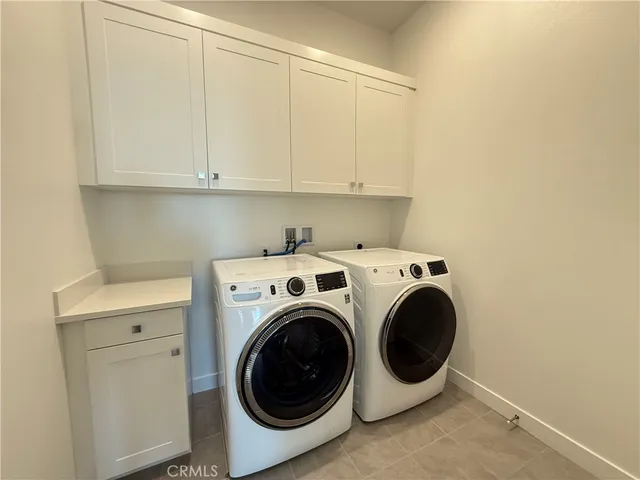 a spacious bathroom with a shower sink vanity mirror and toilet