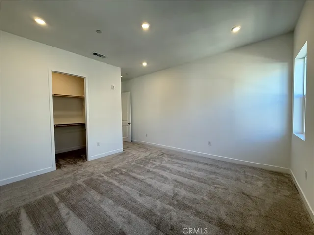 a view of a livingroom and a hallway