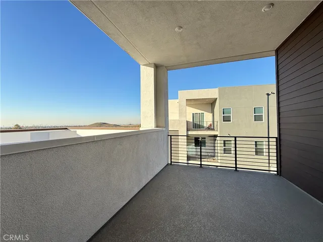 a large kitchen with stainless steel appliances granite countertop a sink and cabinets