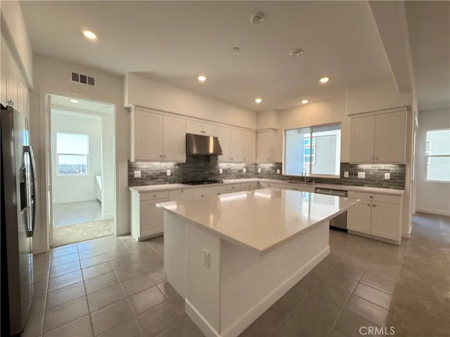 a view of a house with a wooden floor and a window