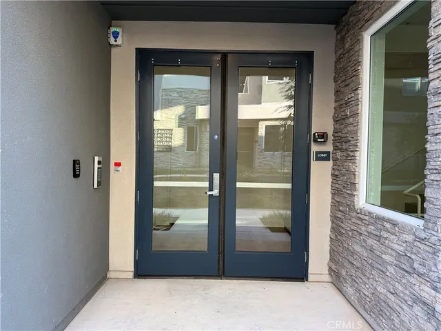a front view of a house with yard and green space