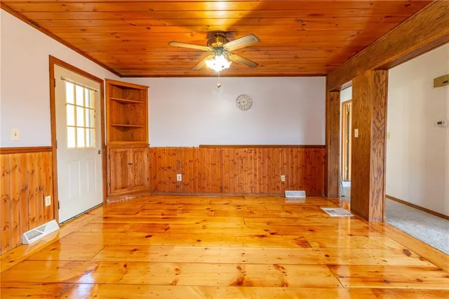 a view of a kitchen with stainless steel appliances granite countertop a stove a sink and dishwasher
