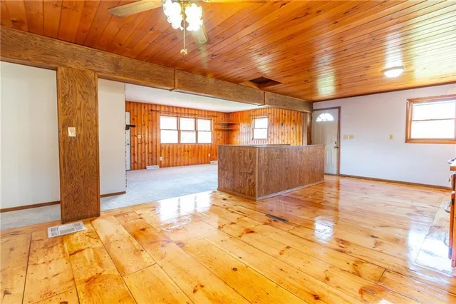 a view of a room with a kitchen