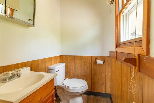 a view of a livingroom with entryway and a window