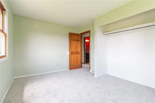 a view of a balcony with wooden floor