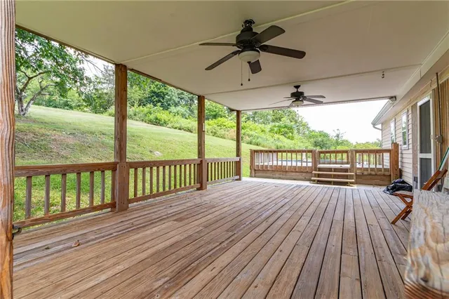 a view of empty room with wooden ceiling