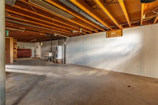 a view of a swimming pool with a patio and a yard