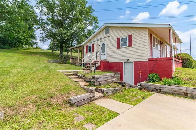 a front view of a house with garden