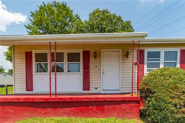 front view of a house with a street
