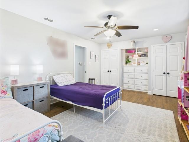 902 Ward Lane Athens, TX 75751 - Photo 22 of 40 a bedroom with a bed and a chandelier