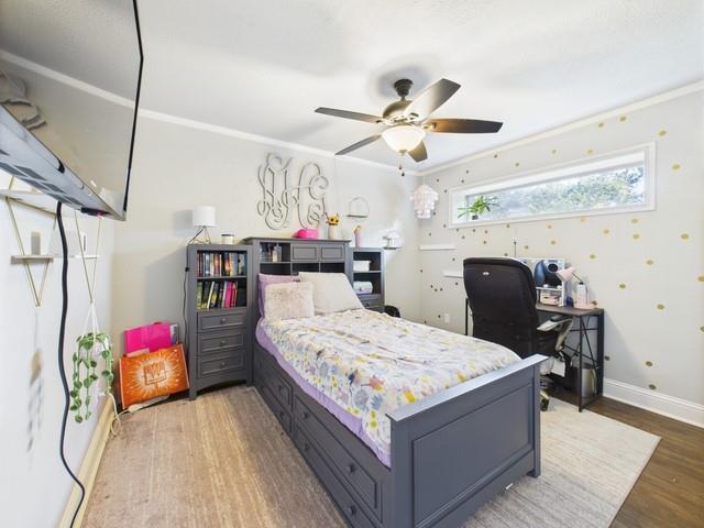 902 Ward Lane Athens, TX 75751 - Photo 23 of 40 a very nice looking bedroom with a large bed a chandelier and a dresser