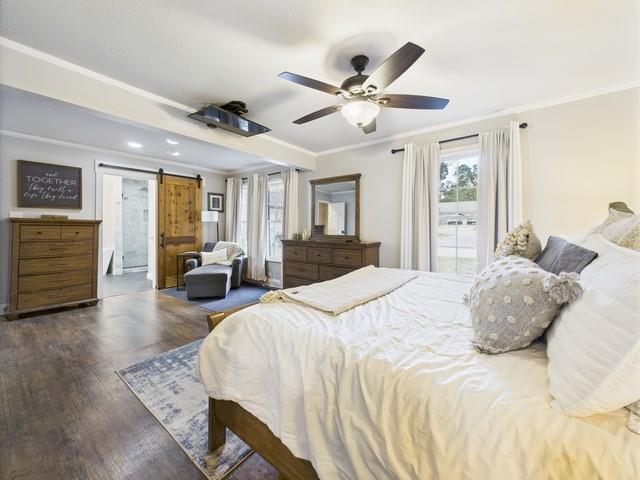 902 Ward Lane Athens, TX 75751 - Photo 24 of 40 a spacious bedroom with a bed a dresser and wooden floor