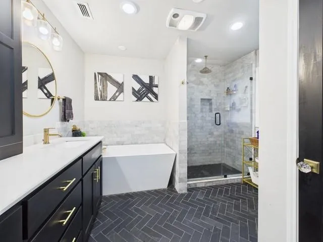 a white house that has a tree in front of it