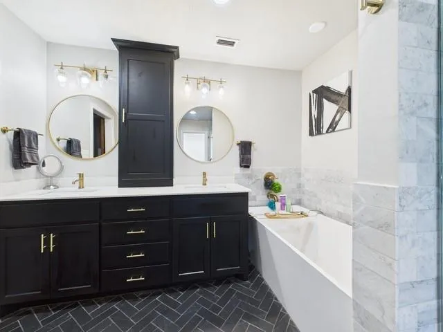 a front view of a house with yard and green space