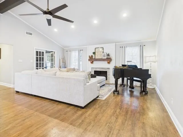 a room with gym equipment and view of living room