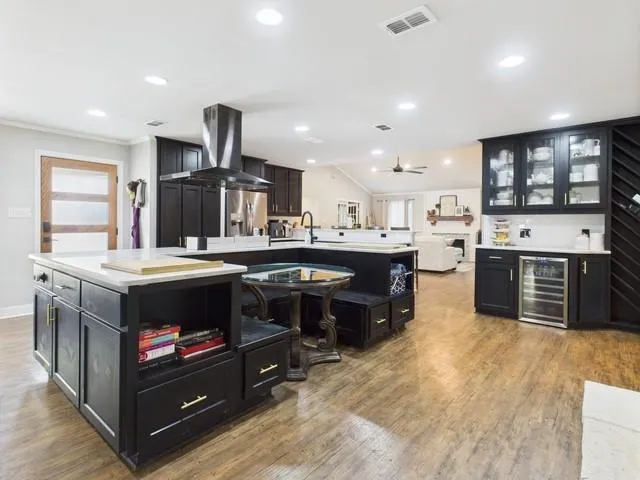 a dining room with furniture a chandelier and window