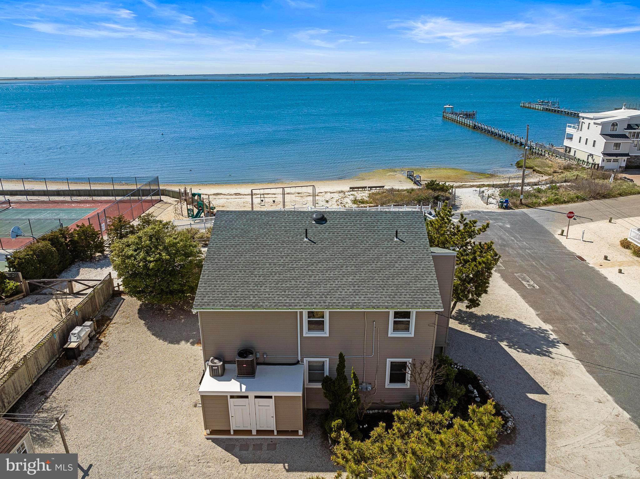 24 Joan Road Long Beach Township, NJ 08008 - Photo 49 of 55 a front view of a house with a yard
