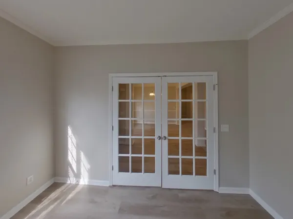 a view of empty room with windows
