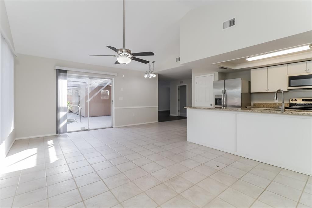 12907 Cedar Ridge Drive Hudson, FL 34669 - Photo 10 of 21 a view of a kitchen with furniture and a kitchen