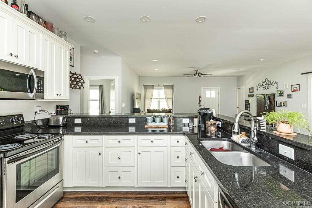 4111 Cedar Plains Road Sandy Hook, VA 23153 - Photo 11 of 28 a kitchen with granite countertop a sink a stove and cabinets