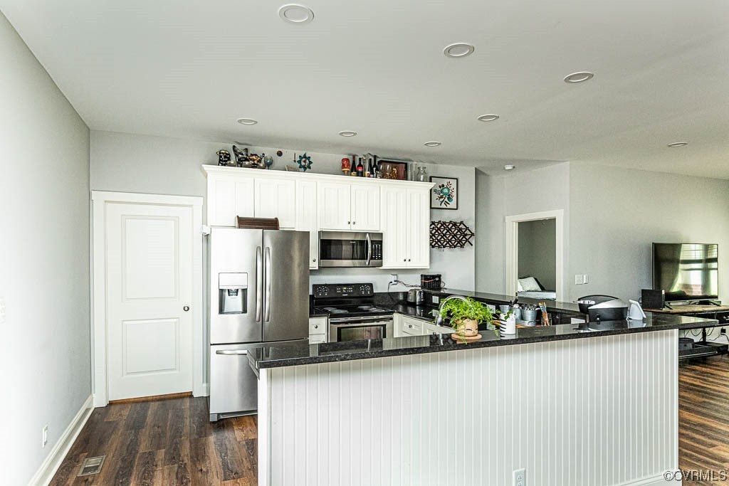 4111 Cedar Plains Road Sandy Hook, VA 23153 - Photo 12 of 28 a kitchen with stainless steel appliances a refrigerator and a stove top oven