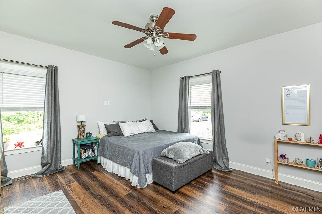4111 Cedar Plains Road Sandy Hook, VA 23153 - Photo 14 of 28 a bedroom with a large bed and a window