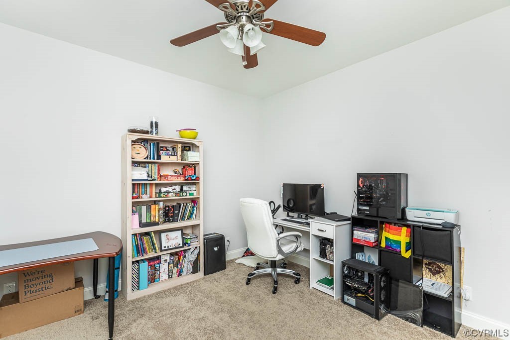 4111 Cedar Plains Road Sandy Hook, VA 23153 - Photo 18 of 28 a view of a workspace with a bookshelf