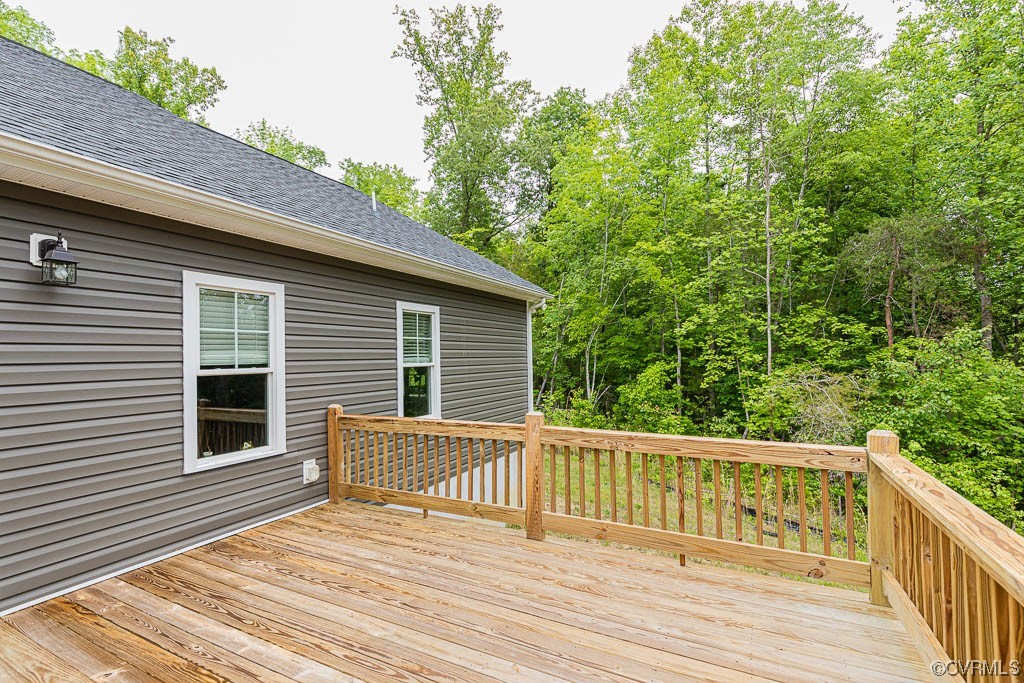 4111 Cedar Plains Road Sandy Hook, VA 23153 - Photo 24 of 28 a view of a wooden chairs on the deck