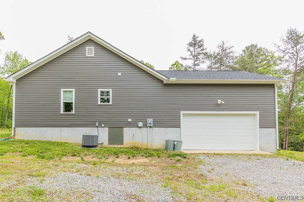 4111 Cedar Plains Road Sandy Hook, VA 23153 - Photo 26 of 28 a front view of a house with a yard
