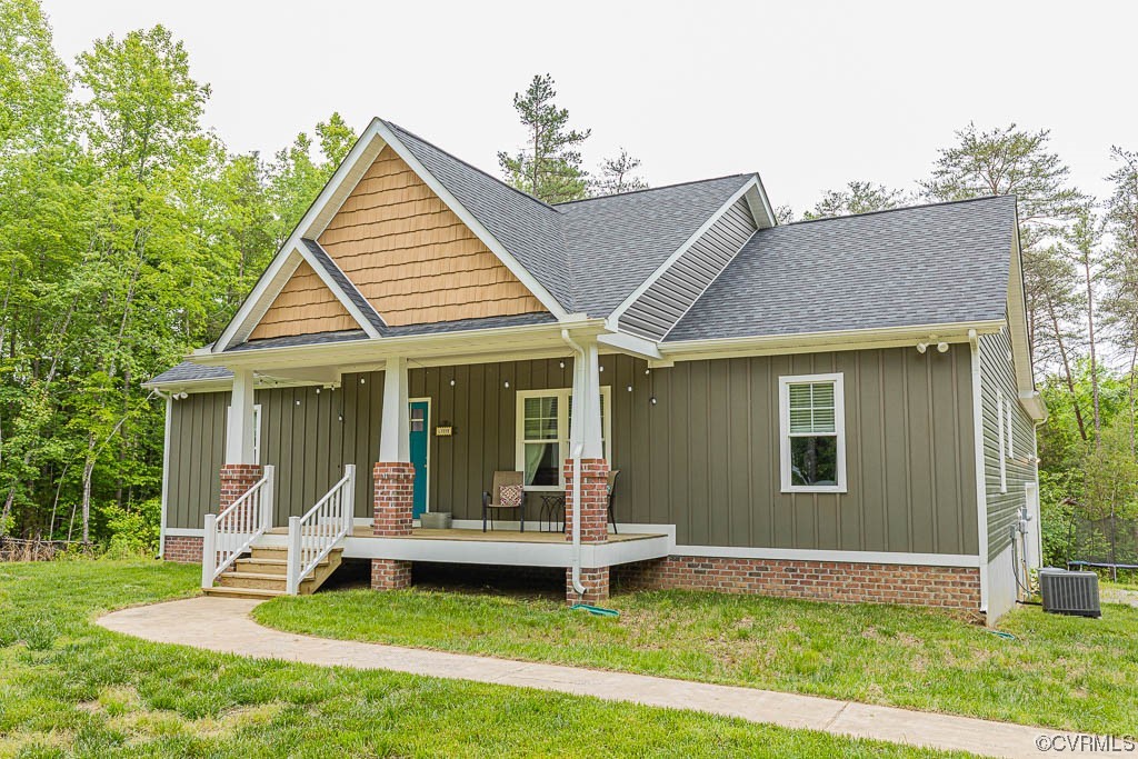 4111 Cedar Plains Road Sandy Hook, VA 23153 - Photo 27 of 28 a view of a house with a yard patio and a garden