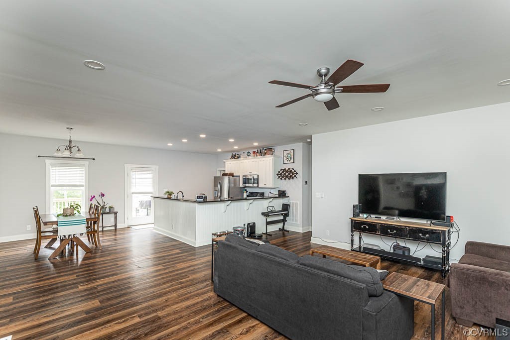 4111 Cedar Plains Road Sandy Hook, VA 23153 - Photo 3 of 28 a living room with furniture and a flat screen tv