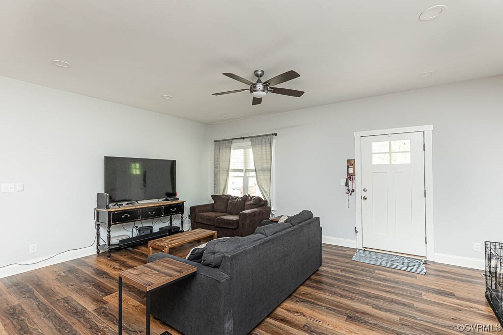 4111 Cedar Plains Road Sandy Hook, VA 23153 - Photo 4 of 28 a living room with furniture and a flat screen tv