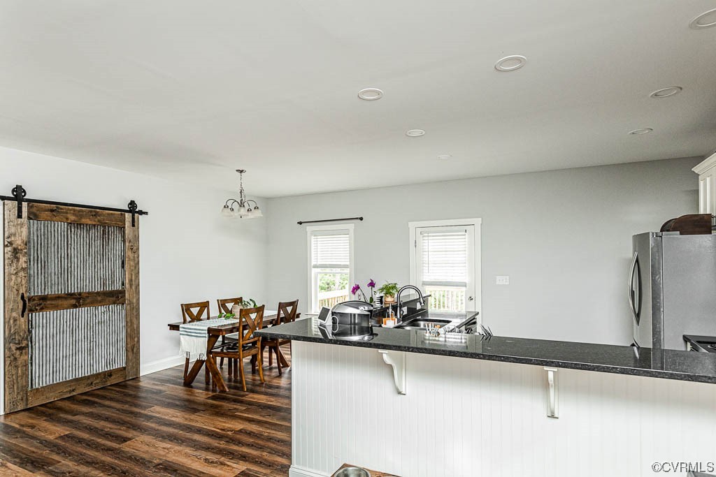 4111 Cedar Plains Road Sandy Hook, VA 23153 - Photo 8 of 28 a view of a dining room with furniture and a chandelier
